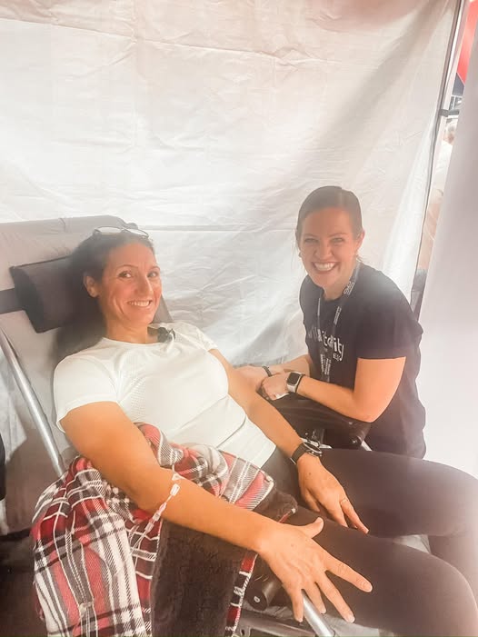 Vital Glow Wellness practitioner administering IV nutrition therapy to a client